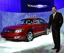 Mark Fields with new 2008 Ford Taurus in Chicago.